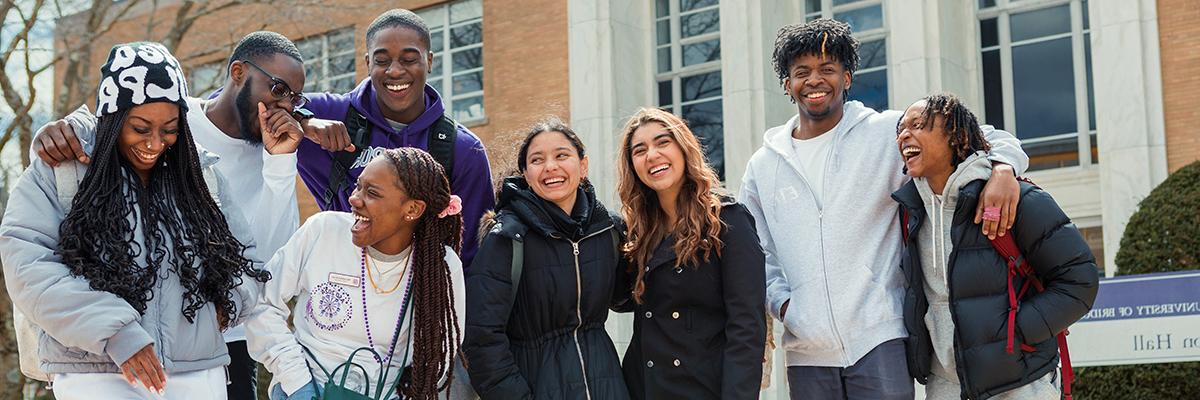 group of smiling and laughing UB students